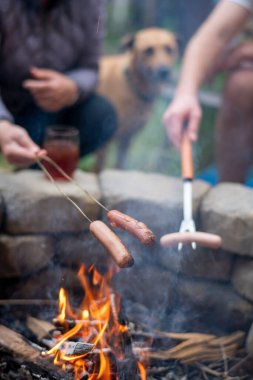 hands with the fire in the camp clipart