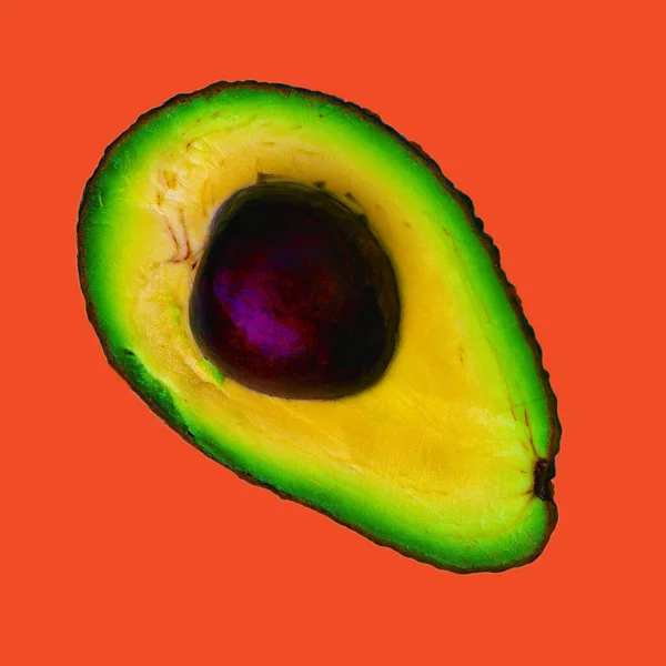 Bright Colored Avocado Cut Half Isolated Lush Lava Color Background — Stock Photo, Image