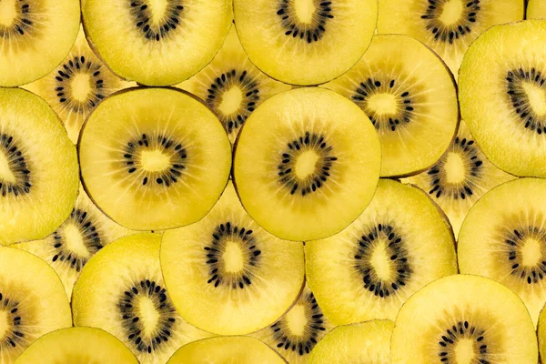 Ovocné Pozadí Složené Mnoha Zlatých Kiwi Plátků — Stock fotografie