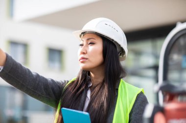 Professional industrial engineer use tablet computer at construction field 