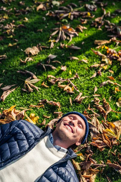 Happy Young Man Relaxing Park Autumn Leaves — 图库照片