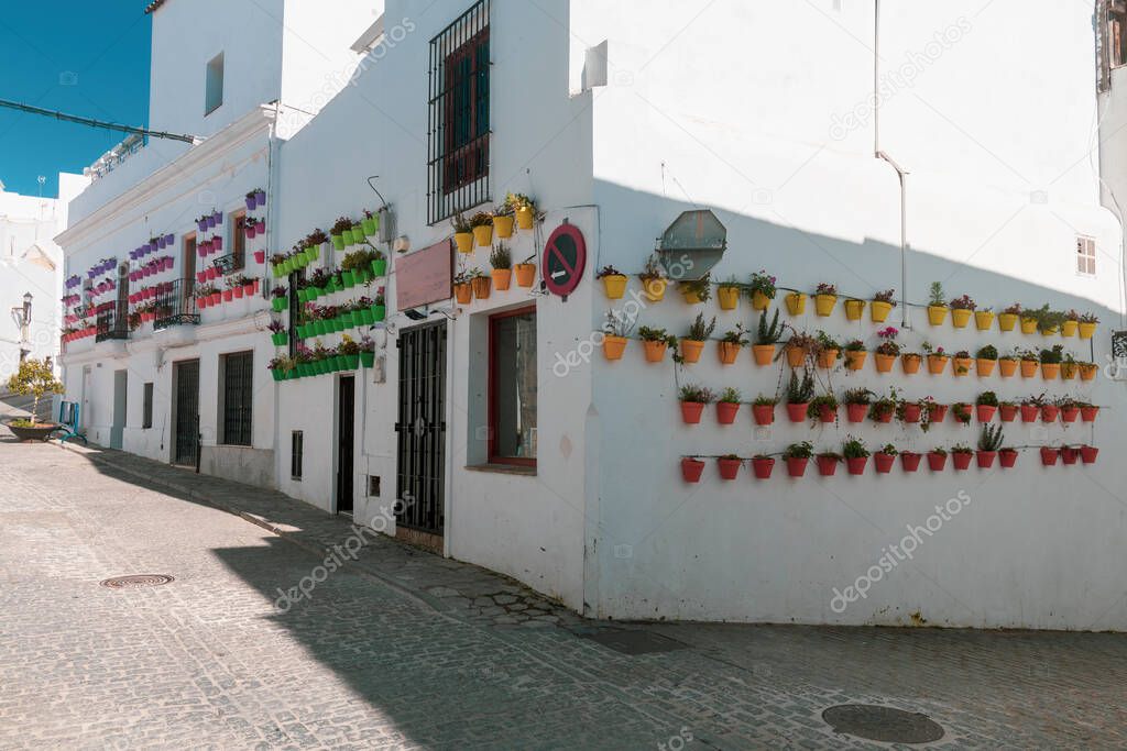 Streets adorned with flower pots in Vejer de la Frontera, Andalusia.