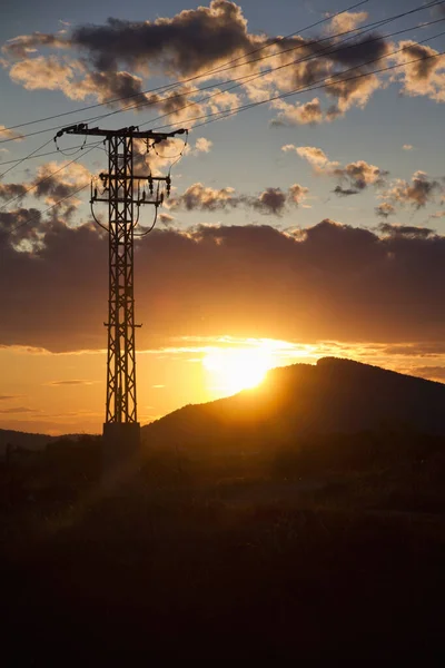 Sunset on the mountain with light tower