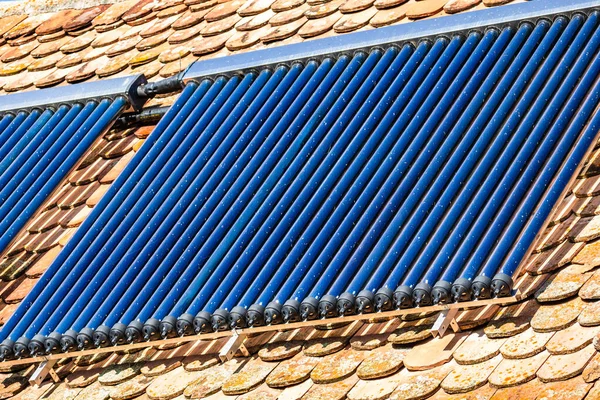 Close up of solar water heater on roof top. Solar panel for hot water, system on roof.