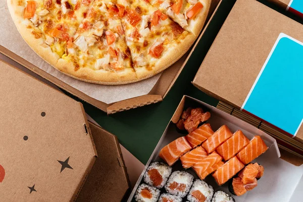 Set of delivery food. pizza sushi rolls