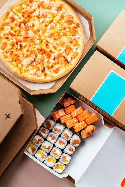 Set of delivery food. pizza sushi rolls