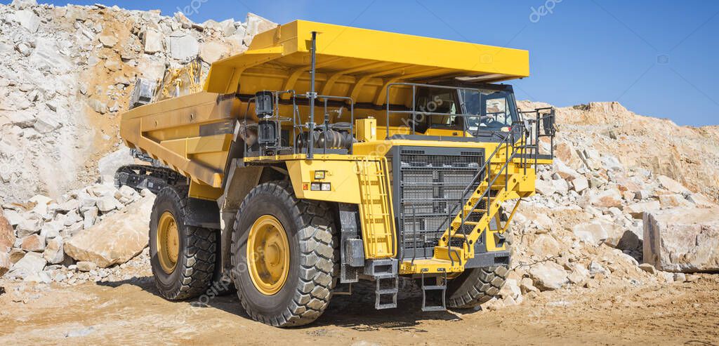 Brand new mining tractor working in open pit mining