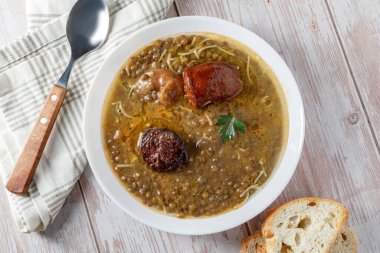 lentil soup with bread and vegetables. top view, copy space