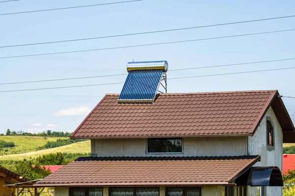 Solar water heater on roof top. Solar panel for hot water, system on roof.