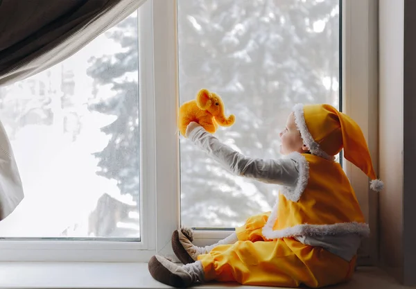 Little Boy Yellow Elf Gnome Costume Sit Windowsill Elephant — Stock Photo, Image