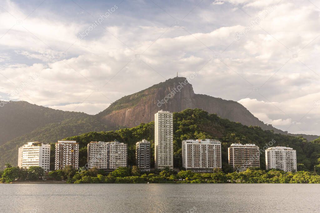 Beautiful view to buildings, city lake and Corcovado Mountain in Rio de Janeiro, Brazil