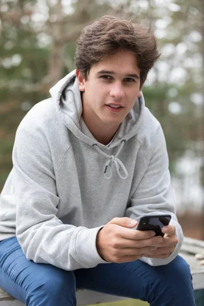 Caucasian Male College Student Looking Camera Holding Cell Phone — Foto Stock