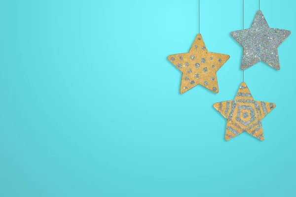 Three handmade star pendants on a blue background