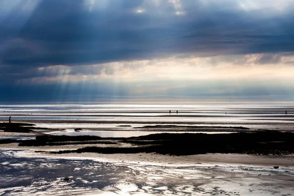 I was struck by the beautiful shafts of light that streamed down on Skaket Beach in Orleans one late summer afternoon this year.