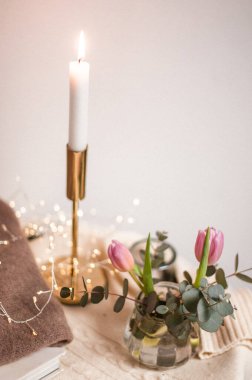 beautiful candles and flowers on table