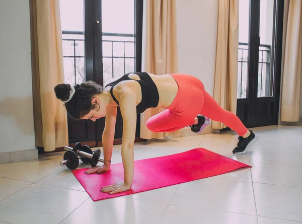 Young Woman Exercising Home Mat Dumbbells — Fotografia de Stock