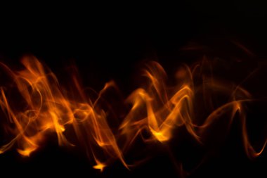 Ateş ve alevlerin dalga şeklindeki soyut görüntüsü