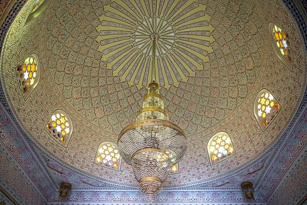 Beautiful ceiling in Islamic, Muslim style with large chandelier and vintage windows.