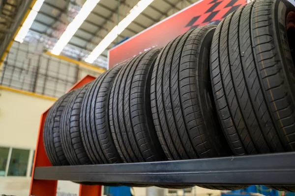 Car tire in shop,Car tires for sale at a tire store,Car tires service.