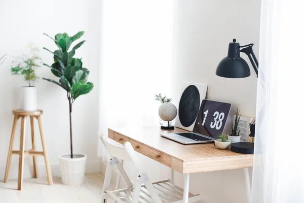 Natural Light Office Space with Wooden Desk and Minimalist Decor