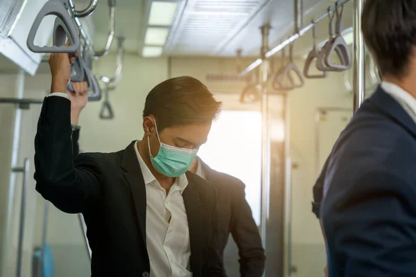 Business people with surgical mask face protection while traveli