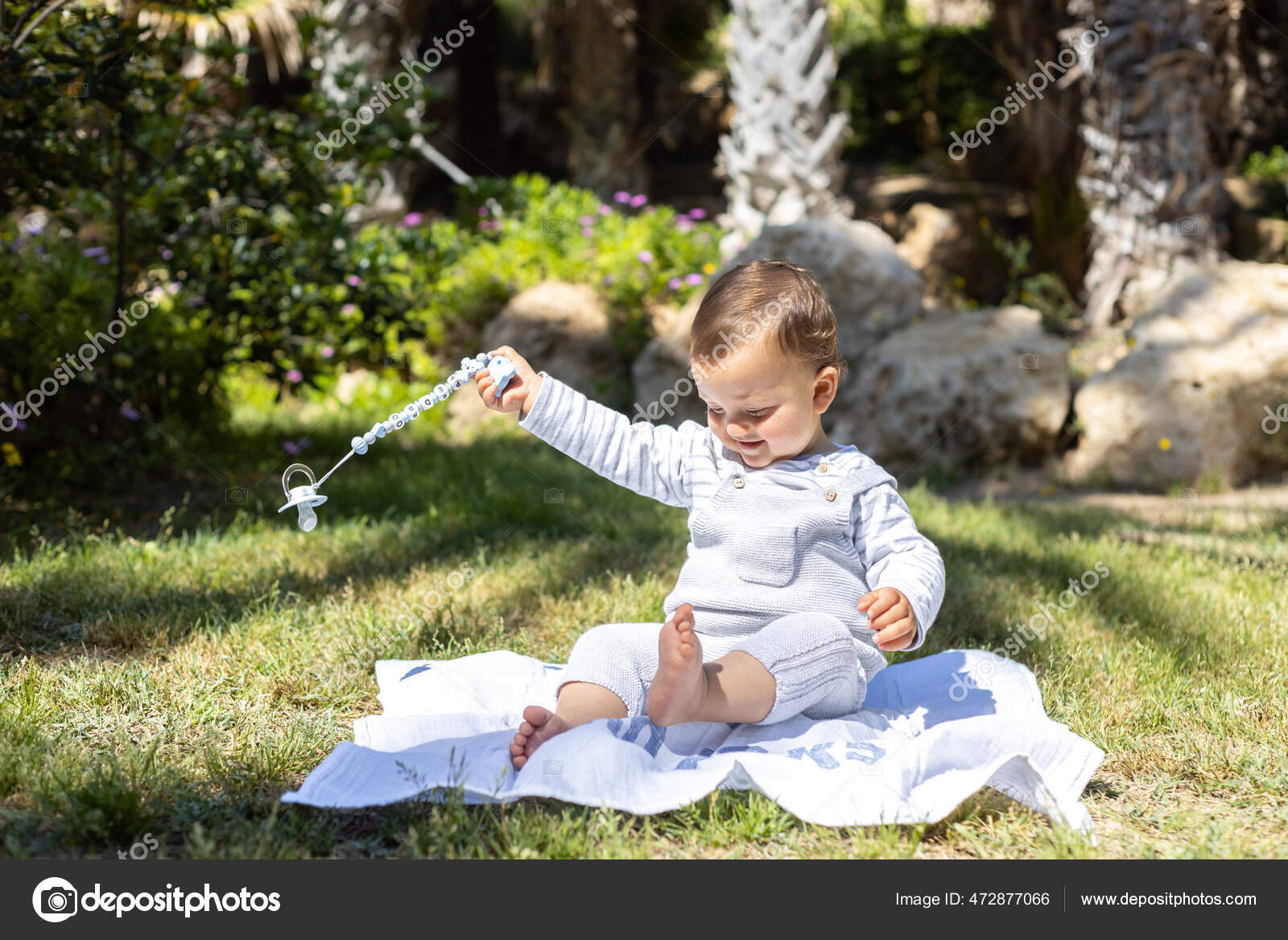 Young Boy Sitting Rock His Playing His Pacifier High Quality Stock ...