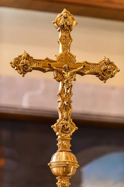 ancient crucifix with jesus in gold in a church