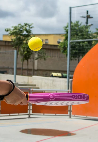 Sportswoman Playing Paddle Tennis. Paddle Tennis On An Urban Court.