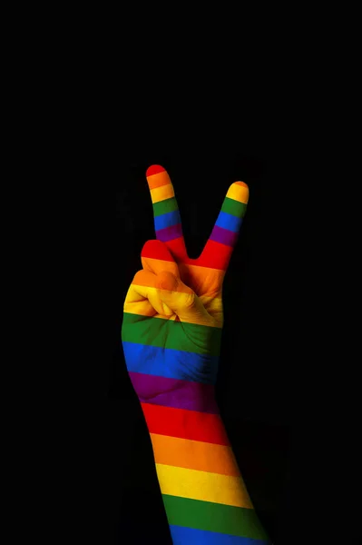 International sign for peace and love gesturing on black backgro