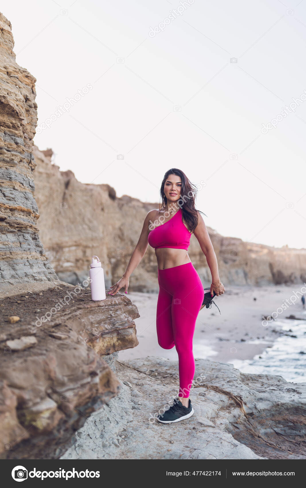 Woman Wearing Hot Pink Workout Clothes Stretching Beach — Stock Photo