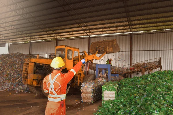 Recycling industry a worker who recycling thing on recycle center