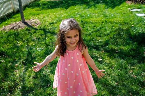 Young Girl Pink Dress Smiling Yard — Stock fotografie