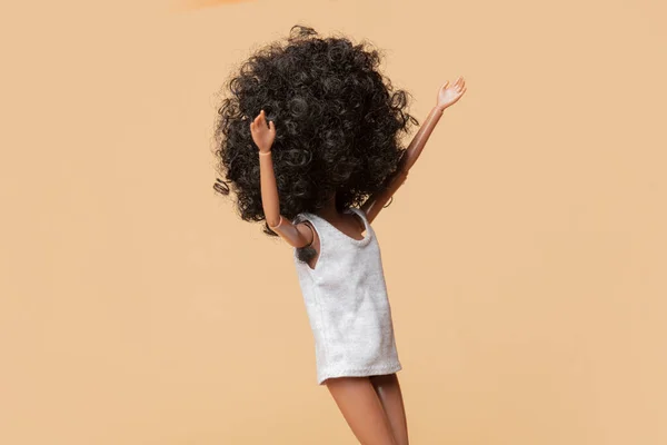 black woman doll with hair in armpits. concept of a feminist movement against armpit hair removal