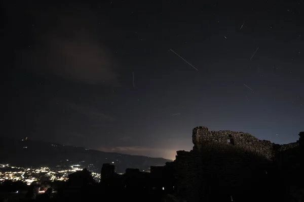 Meteor Shower Shooting star, Perseid on a summer night over a castle