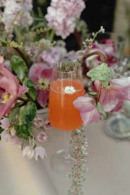 Bright floral cocktail with edible flower garnish
