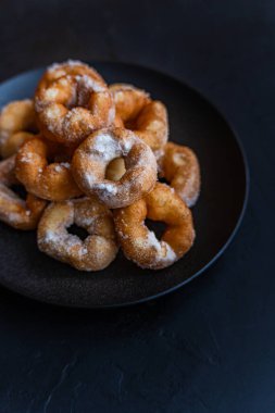 just baked homemade donuts with sugar powder