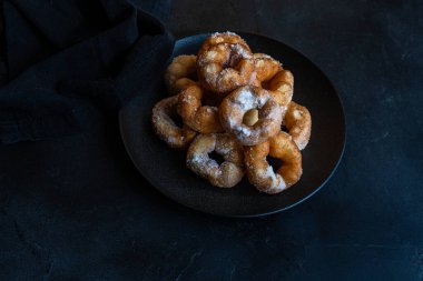 just baked homemade donuts with sugar powder
