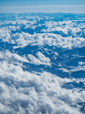Vista View of the Winter Alps Blanketed in Clouds