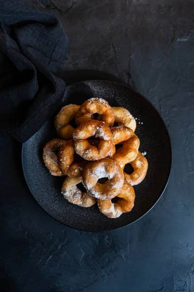 just baked homemade donuts with sugar powder
