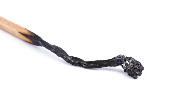 Close-up of a burnt match on white background Royalty Free Stock Images