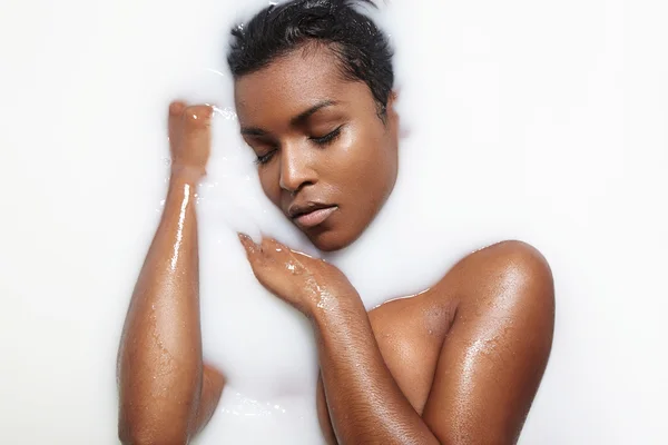 Woman in milk bath — Stock Photo, Image