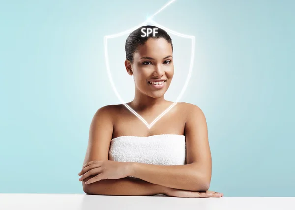 Woman in towel with spf shield — Stock Photo, Image