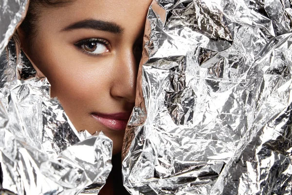 woman wrapped in silver paper