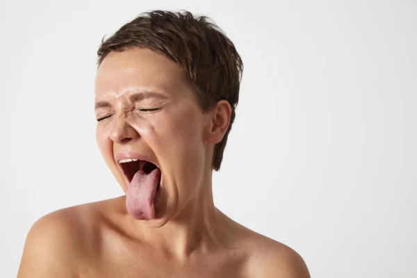 Woman showing her language aside — Stock Photo, Image