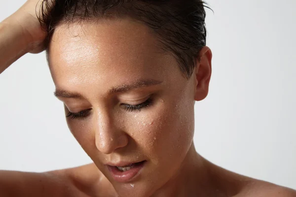 Woman with drops of water on skin — Stock Photo, Image