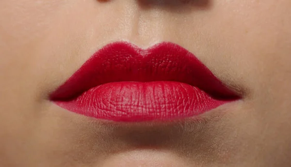 Extreme close up portrait of womans plump lips with red lipstick. High quality photo image — Stock Photo, Image