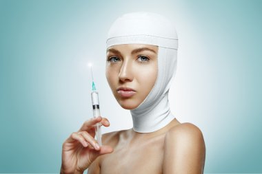 Woman holding botox injection clipart