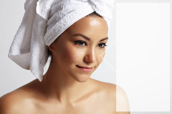 Woman with towel on head — Stock Photo, Image