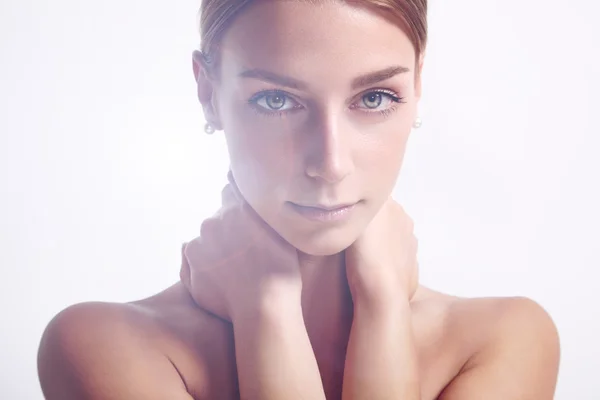 Woman with hands on neck — Stock Photo, Image