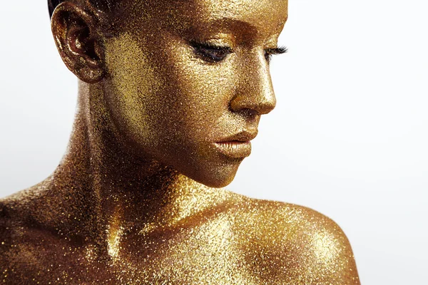 Amazing woman with gold skin — Stock Photo, Image